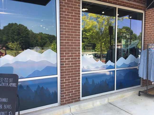 Window signage for the back entrance to a clothing chain in Kennesaw, Ga.